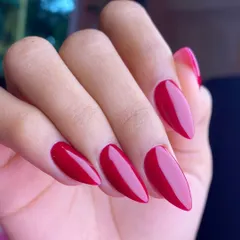 You can never go wrong with a classic red. This set shows perfectly shaped, long almond extensions with a vibrant, glossy red polish for a timelessly chic and confident look.
