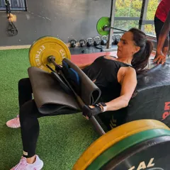 Building powerful glutes is essential for overall strength and stability. This client is performing a heavy barbell hip thrust, a key exercise in my programs for developing lower body power and a strong posterior chain.