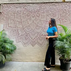 Here I am with the finished mandala mural I created for Cafe Brewing Italiana. This 9 foot wide piece was completed in just 7 hours and adds a rustic charm to their outdoor seating area.