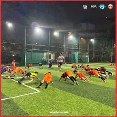 The whole squad in sync. A conditioning drill under the floodlights, building the fitness required to dominate for 90 minutes.