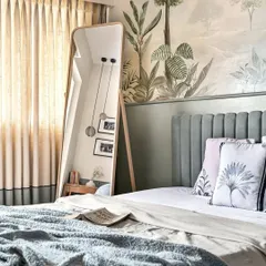This serene bedroom, featured in Elle Decor, is built around a calming, misty forest mural. The hand-painted trees and foliage create a dreamy, atmospheric backdrop that turns the wall behind the bed into a window to an enchanted landscape.