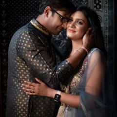 An intimate and tender close-up portrait. The soft lighting and the couple's gentle embrace create a deeply romantic and emotional photograph.