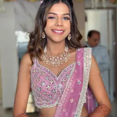This front view shows the face-framing tendrils and the soft curls that complete this romantic hairstyle.
