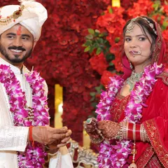 A happy, classic portrait of the couple after their Varmala ceremony. Their smiles show the joy of the moment, a perfect memory to be framed.