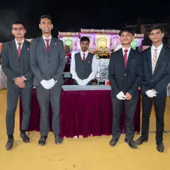 My professional team ready for service at a wedding event. They are dressed in uniform with white gloves, ensuring a high standard of service and hygiene.