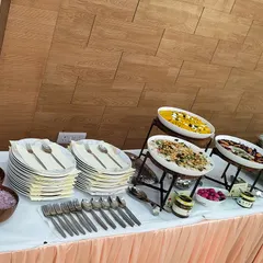 A complete corporate lunch catering spread, featuring appetizers, fresh salads, a rich Indian main course, and desserts. I bring a gourmet experience to your workplace.