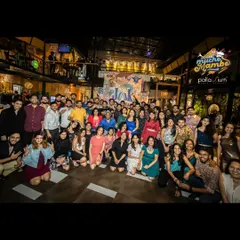 We are more than a dance school; we are a community. This is our crew at a "Mucho Mambo" social night, celebrating our shared passion for dance and connection.