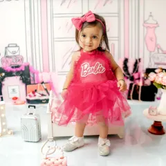 For a fun and fashionable first birthday, this Barbie-themed shoot is perfect. I style the set with chic, playful props to create a vibrant backdrop for your little one's milestone photos.