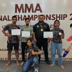 Divya with her silver medal at the FMMAI National MMA Championship. Losses don't define us, they shape us. Her grit and growth inspire everyone at the club.