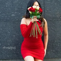 A mysterious and romantic portrait for my Valentine's series. Using a bouquet of roses to partially obscure the face adds an element of artistry and intrigue to the shot.