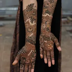 Here, I've blended traditional Indian motifs with bold floral work. The design extends up the arm, creating a statement piece that is both elegant and eye-catching.