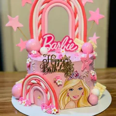 A trendy Barbie cake with rainbow arches and pink stars, perfect for a modern Barbie fan.
