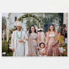 A beautiful family portrait during the groom's procession, capturing multiple generations together in a single, happy frame.