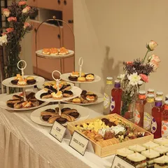 A beautifully arranged catering spread is art you can taste. For this event, I curated a selection of my finest offerings, including a custom cheese platter with artisanal crackers, delicate eclairs, mini fruit tarts, and refreshing beverages, all designed to impress guests at first sight.
