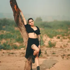 Another look from the 'Wilderness Outlaw' series. The model's pose against the tree in this arid landscape is powerful and tells a story of resilience and strength.
