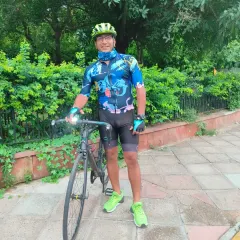 A rider with his sleek road bike, ready for action.