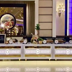 A brightly lit 'Live Tawa Counter' at a grand event. This is where we prepare a variety of hot and fresh vegetarian and non-vegetarian starters.