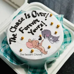 A fun Tom & Jerry bento cake with the message "The Chase Is Over, Forever Yours!" A cute and funny way to celebrate an anniversary or engagement.