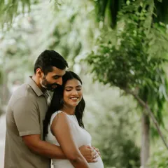 A candid smile captured during a relaxed outdoor couple maternity session. I aim to make you feel comfortable enough to let your genuine happiness shine through.