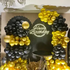 Turning 50 in style! We designed this glamorous disco-themed birthday party using a bold black and gold palette, a custom neon sign, and dramatic balloon arrangements to create a chic and celebratory vibe.