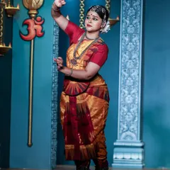 Performing under the symbol of 'Om' during the Natyanjali festival. This photo shows a pose dedicated to the divine, where the entire body is engaged in expressing a single idea. It reflects the spiritual foundation of my dance.