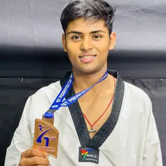 A close-up of Prateek with his hard-earned bronze medal. Every medal represents countless hours of sweat and dedication.