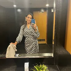 A quick mirror selfie before heading out for a gig. It's all about feeling confident and ready to command the stage.