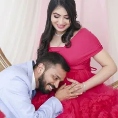 A sweet and intimate pose, with the dad-to-be listening to the baby's kicks. It's these quiet, unscripted feelings we aim to capture in our couple's maternity sessions.
