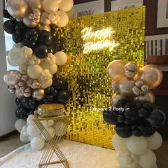 Our gold sequin shimmer wall creates an instant touch of glamour for any event. This popular bachelorette and birthday party setup includes a "Happy Birthday" neon sign and a dramatic balloon garland in a black, white, and gold color scheme.