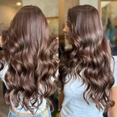This is what I call rich girl hair energy. We achieved this luxurious chocolate brown color and glossy finish with a deep conditioning treatment and a bouncy blowout, proving that simple, rich color can make a huge statement.