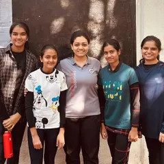 A coach with her group of young female shooters at the Maharashtra Rifle Association. This image highlights the supportive and tight-knit groups that form under the guidance of my mentors.