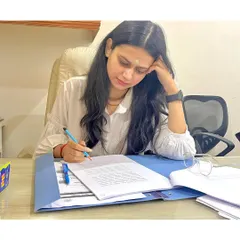 The real work of a lawyer often happens away from the courtroom. Here, I am meticulously reviewing case files and drafting documents, ensuring every detail is perfect before we proceed. My focus is on building a strong, unshakeable case for you.