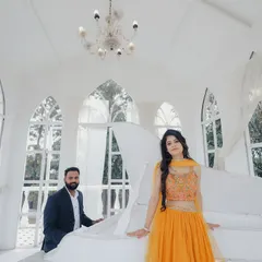 An elegant and classic shot in a studio designed to look like a European conservatory, complete with a white piano. This set is perfect for a sophisticated and timeless look.