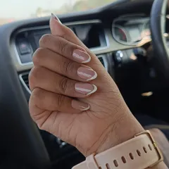 Another angle of this beautiful French manicure. The almond shape is very popular and gives a very elegant look to the hands. This style is perfect for work, events, or just everyday elegance.