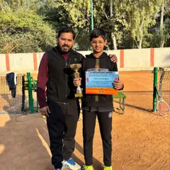 We build champions from a young age. Here I am with Tyakshi Lather, the winner of the AITA Under 12 Championship Series. Her victory is a testament to our focus on foundational skills and competitive mindset.