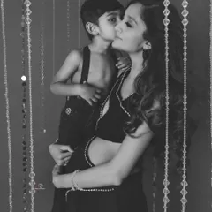 Another beautiful black and white shot from the same session. The way her son kisses her cheek is a memory she will cherish forever.