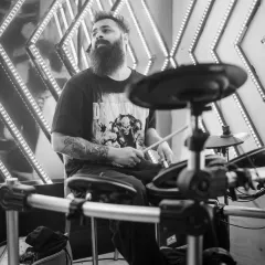 A live drummer laying down the beat alongside my tracks. This fusion of DJing and a live band creates an incredible, high-impact performance.