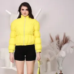 A bright yellow puffer jacket styled for a youthful, modern audience. This is a standard product shot on a model against a clean background for maximum focus on the apparel.