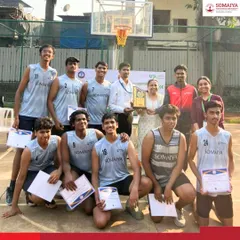 The K. J. Somaiya Polytechnic Boys Basketball Team celebrates with their trophy after winning the IEDSSA A2 Zone Tournament.