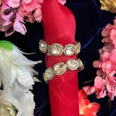 A pair of statement Polki and AD bangles. These bold pieces are perfect for adding some sparkle to your wrist for a party or festive event.