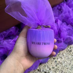 We created these lavender holographic candles for a twin birth announcement. The custom "We are twins" text makes it a unique and personal gift.
