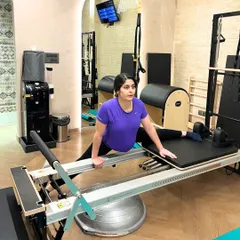 A safe and effective side split on the Reformer for our prenatal client, helping to maintain hip mobility and flexibility.