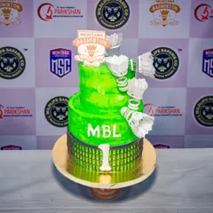 A sporty two-tier cake for the Montana Badminton League. The cake is vibrant green and decorated with a badminton net design and edible shuttlecocks, perfect for celebrating a tournament.
