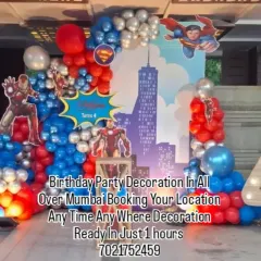 I design action-packed superhero themes for your child's special day. This setup features an Avengers theme with Iron Man and Superman, a city skyline backdrop, and a large light-up number '4' to make the celebration unforgettable.