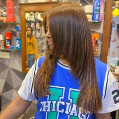 This client's new balayage colour looks fantastic with her layered haircut. The colour placement highlights the movement in her hair.
