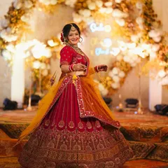 Another beautiful shot of bride Proneeta. Her happy smile and the stunning floral backdrop create a perfect wedding day portrait.