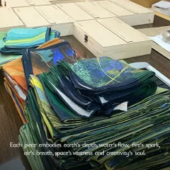 We believe craftsmanship can exist at any scale. Here, we are preparing a large corporate order of our 'Panchabhuta' themed scarves, each one folded with care. Every piece receives the same attention, whether you need ten gifts or three hundred.