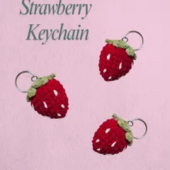 A trio of my handmade strawberry keychains. I make these with a little bit of stuffing to make them plump, and the white "seeds" are embroidered on by hand. They are a sweet and simple accessory.