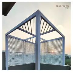 This minimalist white metal pergola was designed for a rooftop terrace to frame the sky and sunset views. The perforated side panels add a degree of privacy and architectural interest, making it a sculptural and practical addition to the space.