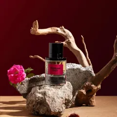 An earthy and artistic still life for a fragrance. We used natural elements like stone, driftwood, and a fresh rose to capture the rich, natural essence of this Persian Oud perfume.
